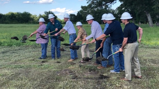 Board members breaking ground